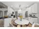 Bright kitchen with white cabinets, stainless steel appliances, and an adjacent dining area at 122 Long Cove Ln, Mooresville, NC 28117