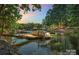Beautiful lakefront property with a private dock and boat lift and lush landscaping at 122 Long Cove Ln, Mooresville, NC 28117