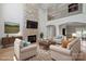 Elegant living room with a stone fireplace, hardwood floors, and an open floor plan at 122 Long Cove Ln, Mooresville, NC 28117