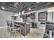 Finished basement with a modern wet bar featuring wine storage, barstool seating and a tv at 122 Long Cove Ln, Mooresville, NC 28117