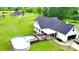 Home with an above-ground pool, large deck, and a spacious lawn at 1238 Shinnville Rd, Cleveland, NC 27013
