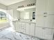 Bright bathroom with double vanity, large mirror, marble tile, and natural light at 1238 Shinnville Rd, Cleveland, NC 27013