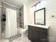 Charming bathroom with white shiplap, tiled shower, and modern vanity at 1238 Shinnville Rd, Cleveland, NC 27013