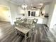 This dining area features wood-look flooring and a dining table with chairs at 1238 Shinnville Rd, Cleveland, NC 27013
