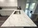Modern kitchen island featuring stainless steel sink and elegant countertops at 1238 Shinnville Rd, Cleveland, NC 27013