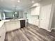 Bright kitchen with white cabinets, modern appliances, and beautiful countertops and flooring at 1238 Shinnville Rd, Cleveland, NC 27013
