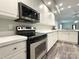 Stainless steel oven and microwave set in this kitchen with white cabinets and countertops at 1238 Shinnville Rd, Cleveland, NC 27013