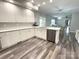 Bright kitchen with white cabinets, modern appliances, and beautiful countertops and flooring at 1238 Shinnville Rd, Cleveland, NC 27013