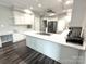 Spacious kitchen with a large island, stainless steel appliances, and modern countertops at 1238 Shinnville Rd, Cleveland, NC 27013