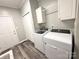 Convenient laundry room featuring modern washer and dryer, along with ample storage cabinets at 1238 Shinnville Rd, Cleveland, NC 27013