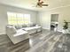 Comfortable living room with a large sectional sofa and view into the bedroom at 1238 Shinnville Rd, Cleveland, NC 27013