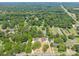 Aerial view of the gray home nestled among lush greenery and neighboring properties at 126 Aurora Blvd, Matthews, NC 28105