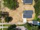 An aerial view of the home showcasing the landscaping, sidewalk, and driveway at 126 Aurora Blvd, Matthews, NC 28105
