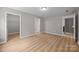 Bedroom with multiple doorways, and luxury vinyl plank flooring at 126 Aurora Blvd, Matthews, NC 28105