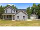 Charming two-story home with gray siding and a well-maintained yard at 126 Aurora Blvd, Matthews, NC 28105