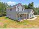 An elevated view of the front of the two-story home with covered porch and landscaped yard at 126 Aurora Blvd, Matthews, NC 28105