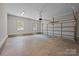 Spacious two-car garage with windows, gray walls and concrete floor for parking or storage at 126 Aurora Blvd, Matthews, NC 28105