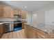 Well-appointed kitchen with stainless appliances, granite countertops, and center island at 126 Aurora Blvd, Matthews, NC 28105