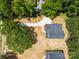 Aerial view of a home showcasing its driveway, landscaping, and surrounding greenery at 130 Aurora Blvd, Matthews, NC 28105