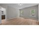 A bedroom with two windows offers plenty of natural light at 130 Aurora Blvd, Matthews, NC 28105
