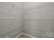 A walk-in closet provides ample shelving for storage at 130 Aurora Blvd, Matthews, NC 28105