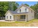 New construction home features a covered front porch at 130 Aurora Blvd, Matthews, NC 28105