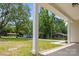 View from the covered porch shows the yard and a quiet street at 130 Aurora Blvd, Matthews, NC 28105