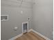 Neutral laundry room with a pet door and utility connections at 130 Aurora Blvd, Matthews, NC 28105