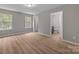 Bright main bedroom with wood-look flooring and ensuite bathroom at 130 Aurora Blvd, Matthews, NC 28105