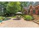Outdoor living space with pool, patio, and lush landscaping, perfect for relaxation and entertaining at 1310 Weddington Hills Dr, Matthews, NC 28104