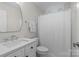 Clean bathroom with white cabinetry, modern sink and fixtures, and a tub/shower combination at 1310 Weddington Hills Dr, Matthews, NC 28104