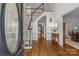 Bright foyer with hardwood floors, staircase, and traditional design elements, creating a grand entrance at 1310 Weddington Hills Dr, Matthews, NC 28104