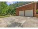 Spacious two-car garage with a brick exterior and a paved driveway at 1310 Weddington Hills Dr, Matthews, NC 28104