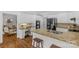 Modern kitchen with white cabinets, granite countertops, and stainless steel appliances, perfect for cooking and entertaining at 1310 Weddington Hills Dr, Matthews, NC 28104