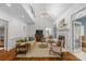 Spacious living room with high ceilings, fireplace, and elegant furnishings, ideal for relaxation and entertaining at 1310 Weddington Hills Dr, Matthews, NC 28104