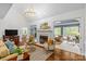 Bright living room with fireplace, open layout, and multiple seating areas, perfect for gathering and relaxing at 1310 Weddington Hills Dr, Matthews, NC 28104