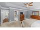 Well-lit main bedroom featuring a neutral color palette, dresser, and adjoining bathroom at 1310 Weddington Hills Dr, Matthews, NC 28104