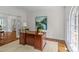 Sunlit office with hardwood floors, classic desk, and serene views, perfect for a productive workspace at 1310 Weddington Hills Dr, Matthews, NC 28104