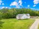 Aerial view of a well-maintained home with a large yard and mature trees at 132 Witherspoon Ln, Statesville, NC 28677