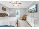 Comfortable bedroom featuring neutral walls, carpet, a ceiling fan, a picture window, and TV at 132 Witherspoon Ln, Statesville, NC 28677