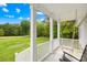 Inviting front porch featuring a classic swing, offering a relaxing outdoor space with views of the lush greenery at 132 Witherspoon Ln, Statesville, NC 28677