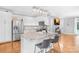 Bright kitchen with white cabinets, granite counters, stainless steel appliances, and island with bar seating at 132 Witherspoon Ln, Statesville, NC 28677