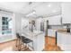 Modern kitchen featuring white cabinets, granite counters, stainless steel appliances, and island with bar seating at 132 Witherspoon Ln, Statesville, NC 28677