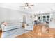 Cozy living room and dining area with hardwood floors, featuring comfortable seating and stylish decor at 132 Witherspoon Ln, Statesville, NC 28677