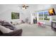 Spacious playroom with ample natural light, a comfortable couch, and play table set at 132 Witherspoon Ln, Statesville, NC 28677