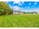 Expansive green lawn and a charming home with a welcoming front porch at 132 Witherspoon Ln, Statesville, NC 28677