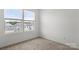 Bright bedroom with large window and neutral carpet at 15034 Scoter St, Charlotte, NC 28262