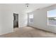 Bedroom with view of bathroom and natural light from dual windows at 15034 Scoter St, Charlotte, NC 28262