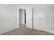 Bedroom with white walls and two doors at 15034 Scoter St, Charlotte, NC 28262