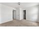 Bedroom featuring neutral carpeting, two doorways, and ample natural light at 15034 Scoter St, Charlotte, NC 28262
